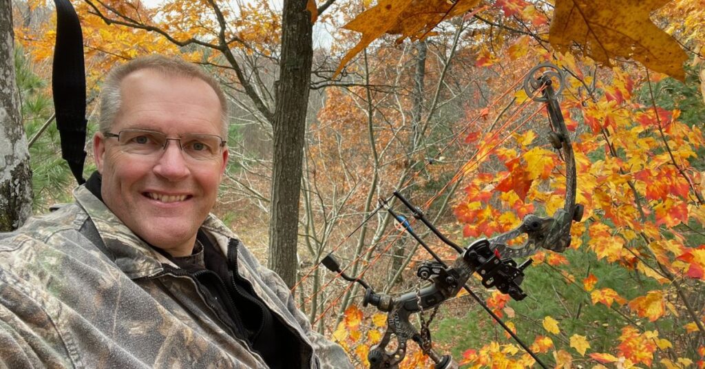 Bow Hunter in a treestand in the West Michigan woods