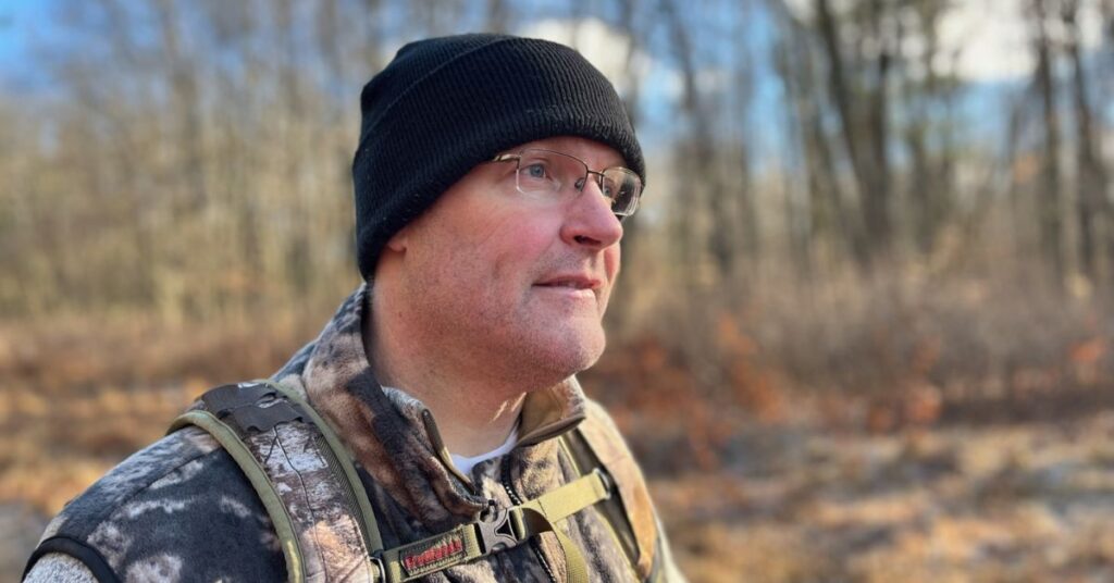 Scott walking in Michigan woods