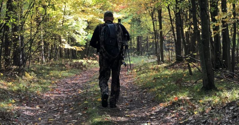 Hunter walking and scouting land