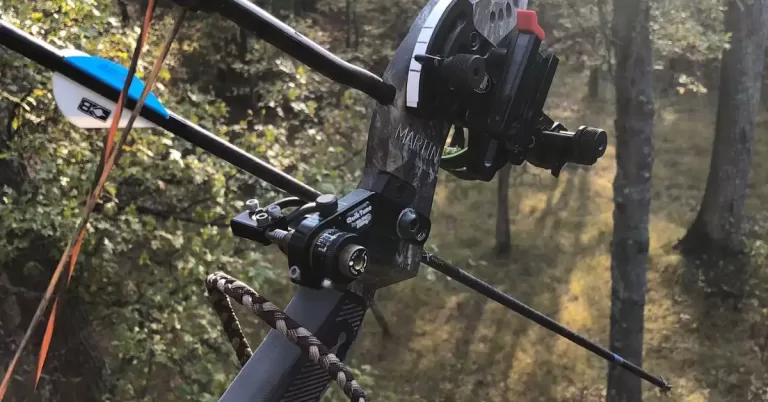 Closeup photo of compound bow and arrow