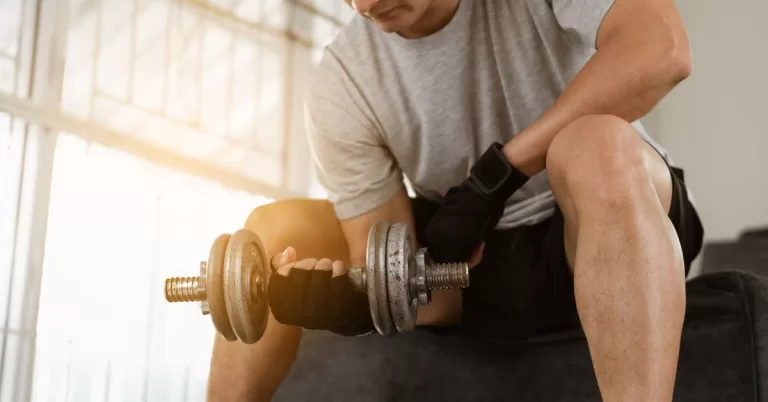 Athlete exercising and doing bicep curls