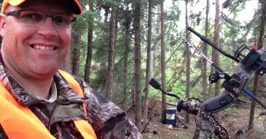Deer hunter in tree stand