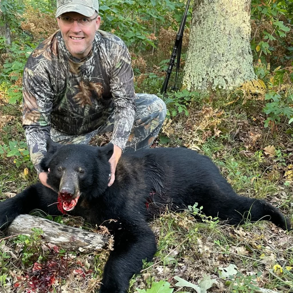 Hunter with black bear