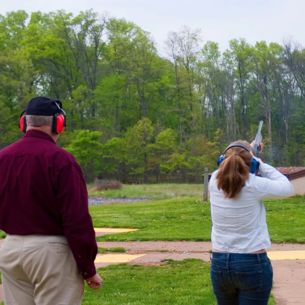 Instructor standing with field day student