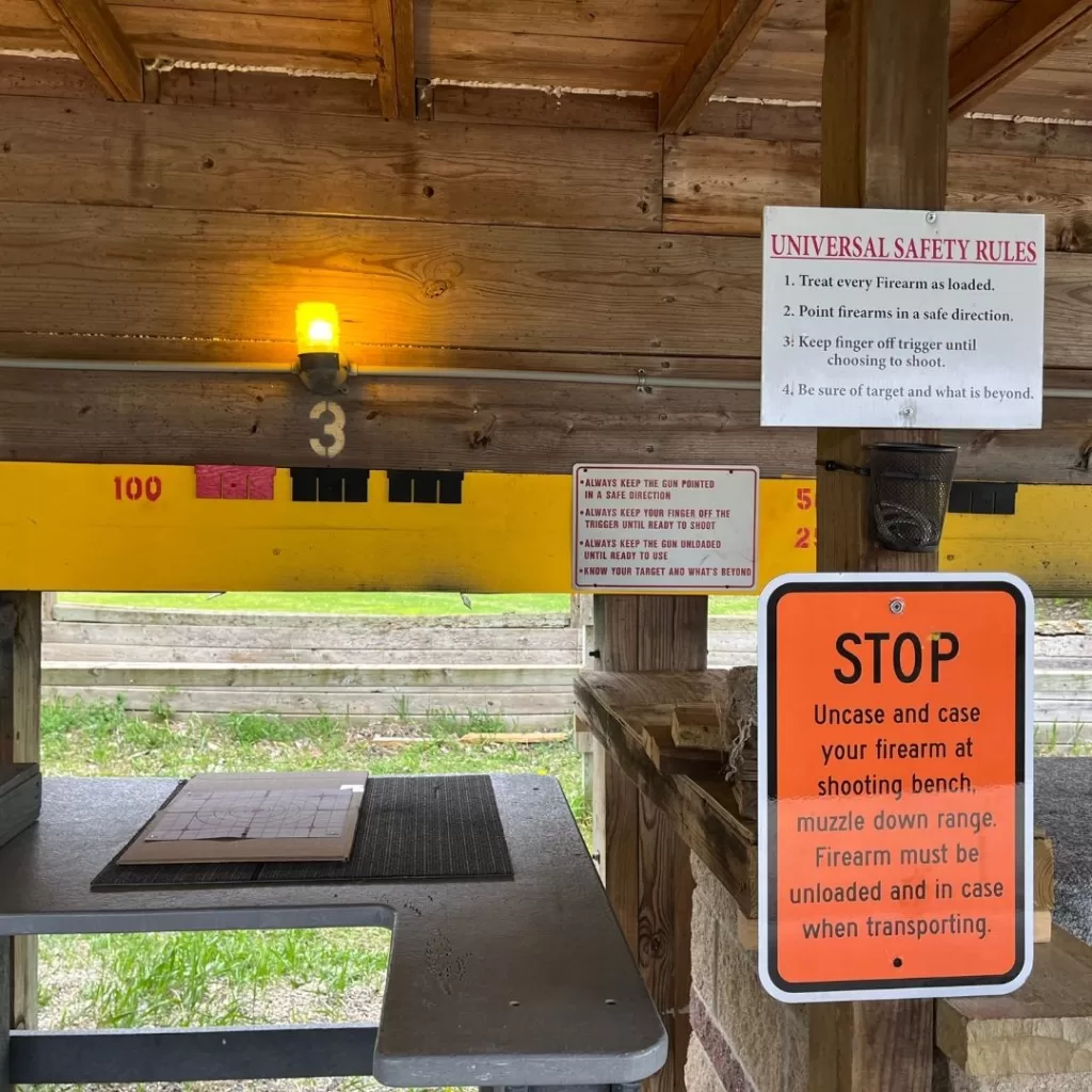 Instruction signs with rules on display at a gun range.