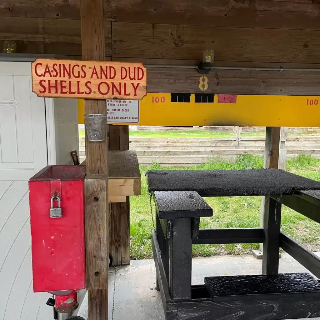 Red box and sign that reads "Casings and Dud Shells only"
