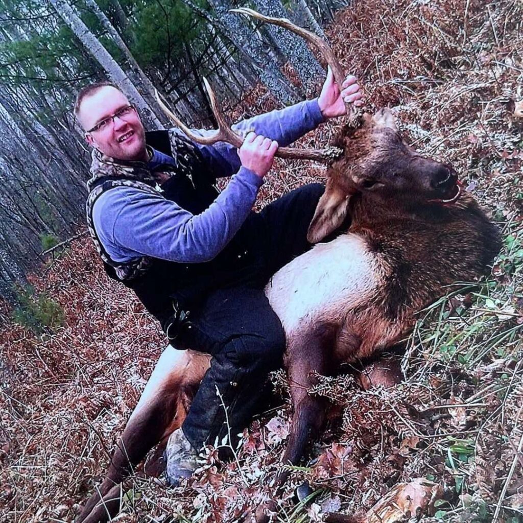 hunter posing by Elk Kill
