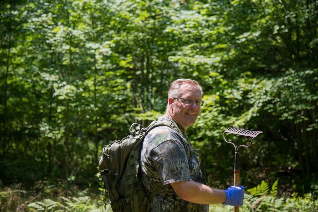 Happy hunter walking out of the woods