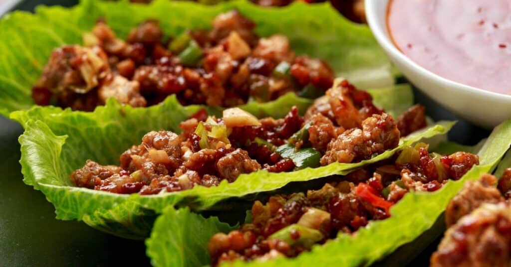 Large leaves of green lettuce with scoops of ground turkey for a 5 ingredient recipe